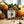 Soap bar from Potager Soap Co. with holiday spices and fruits on a wooden surface