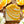Bar of orange dreamsicle soap with 'POTAGER SOAP CO.' branding on a wooden surface with orange slices and ylang ylang flowers.