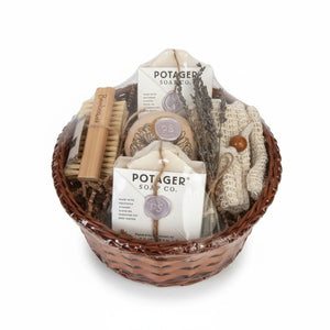 Potager Soap Co. artisan bath gift basket with handcrafted soaps, bamboo brush, wash mitt, and dried lavender.