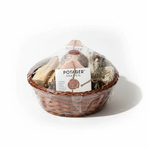 Potager Soap Co. artisan bath gift basket with handcrafted soaps, bamboo brush, wash mitt, and dried lavender.
