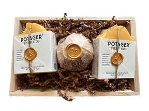 Potager Soap Co. artisan gift set featuring two Lemongrass Calendula soap bars and a bath bomb in a wooden crate.