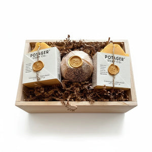 Potager Soap Co. artisan soap gift set featuring two lemongrass calendula bars and a bath bomb in a wooden crate.