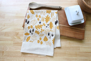Potager Soap Co. handprinted natural cotton kitchen towel with golden ochre leaves and chocolate brown acorns