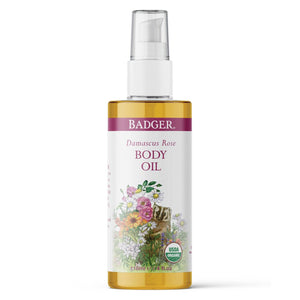 Potager Soap Co. Badger Damascus Rose body oil in a clear pump bottle with floral and badger illustration