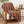 Potager Soap Co. brown faux rabbit fur throw blanket with ribbed texture draped over a wooden armchair
