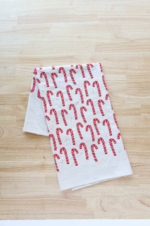 Potager Soap Co. handprinted unbleached cotton kitchen towel featuring a festive red candy cane pattern.