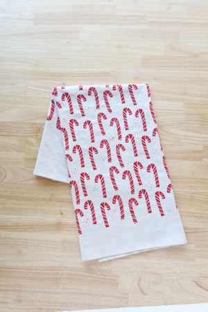 Potager Soap Co. handprinted natural cotton kitchen towel featuring a festive red candy cane pattern for Christmas.