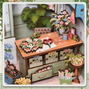Potager Soap Co. Champs-Élysées Florist DIY book nook kit featuring a detailed miniature wooden flower shop workbench.