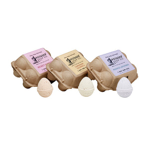 Potager Soap Co. egg-shaped bath bombs in recycled paper cartons with Secret Garden, Lemongrass, and Lavender scents.