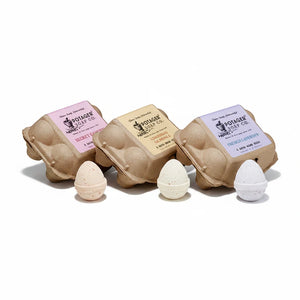Potager Soap Co. egg-shaped bath bombs in recycled paper cartons with Secret Garden, Lemongrass, and Lavender scents.
