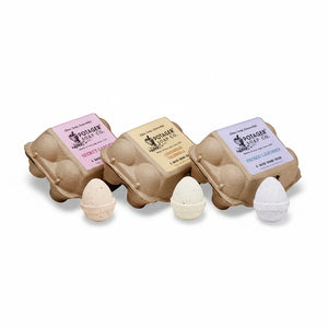 Potager Soap Co. set of three egg-shaped bath bomb cartons in Secret Garden, Lemongrass Calendula, and French Lavender.