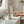 Potager Soap Co. eucalyptus mint bar soap held in hands on a marble bathroom vanity with fresh botanical accents.