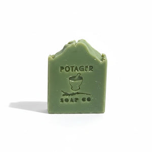 Potager Soap Co. handcrafted eucalyptus mint bar soap in a natural green shade with an embossed logo.
