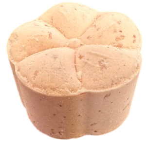 Potager Soap Co. flower-shaped bath bomb in a soft peach hue, crafted with organic botanicals and coconut oil.