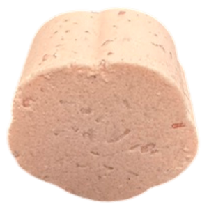 Potager Soap Co. flower-shaped bath bomb in a soft pink hue with visible organic botanical inclusions.