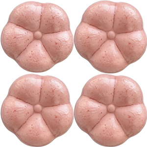 Four Potager Soap Co. flower-shaped pink bath bombs wrapped in clear plastic for a botanical spa experience.