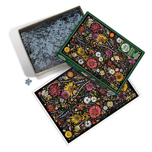 Potager Soap Co. Cobble Hill 1000-piece jigsaw puzzle featuring a vibrant pressed wildflower arrangement on black.