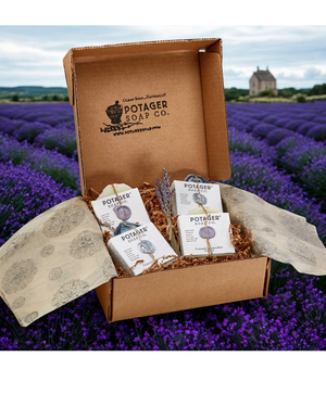 Potager Soap Co. French Lavender soap gift box set with artisanal bars in rustic packaging against a lavender field