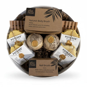 Potager Soap Co. handcrafted gift set in a white linen hat box featuring natural soaps, bath bombs, and brushes.