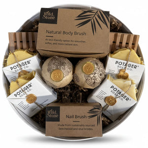 Potager Soap Co. handcrafted gift set in a white linen hat box featuring natural soaps, bath bombs, and brushes.