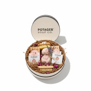 Potager Soap Co. handcrafted gift set in a white linen hat box with soaps, bath bombs, brushes, and dried flowers.