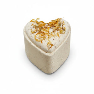 Potager Soap Co. heart-shaped bath bomb topped with dried calendula petals for a soothing botanical bath experience.
