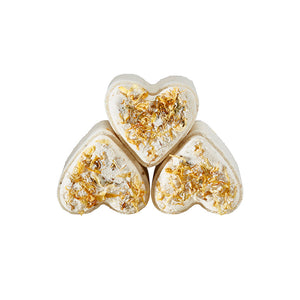 Potager Soap Co. heart-shaped bath bombs topped with dried calendula petals for a soothing botanical spa experience.