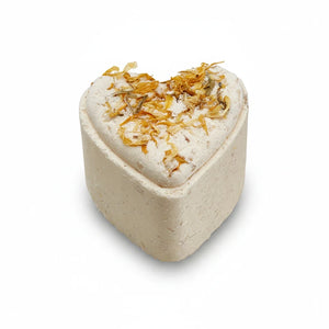 Potager Soap Co. heart-shaped bath bomb topped with dried calendula petals for a relaxing botanical soak.