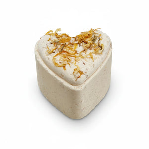 Potager Soap Co. heart-shaped bath bomb with dried calendula petals and a lemongrass scent on a white background.