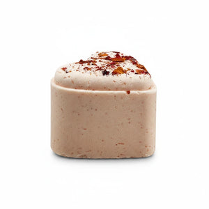 Potager Soap Co. heart-shaped bath bomb in soft pink with dried flower petal topping for a botanical spa experience.