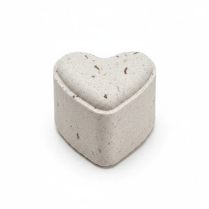 Potager Soap Co. heart-shaped French lavender bath bomb with dried botanical flecks on a white background