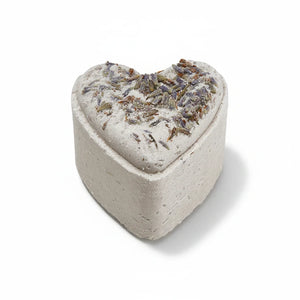 Potager Soap Co. heart-shaped French lavender bath bomb topped with dried botanical flowers on a white background