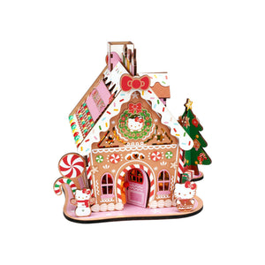 Potager Soap Co. Hello Kitty wooden gingerbread house DIY kit with festive candy decorations and LED lighting.