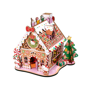 Potager Soap Co. Hello Kitty wooden gingerbread house DIY kit with festive candy decorations and LED lights.