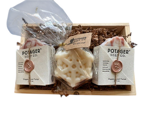 Potager Soap Co. holiday gift set featuring two organic soap bars and a snowflake soap in a rustic wooden tray.
