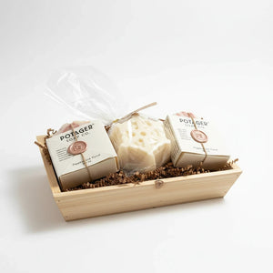 Potager Soap Co. holiday gift set featuring organic soap bars and a snowflake centerpiece in a rustic wood tray.