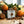 Potager Soap Co. Holiday Spice organic bar soap in white paper packaging with a wax seal, surrounded by citrus and spice
