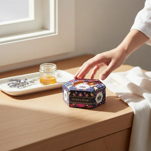 Potager Soap Co. Baudelaire Royal Jelly Honey soap bar in a decorative hexagonal box on a wooden vanity