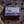 Back of Potager Soap Co. Everyday Lavender bar packaging featuring ingredients list on a wooden table with lavender