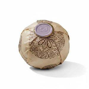 Potager Soap Co. lavender bath bomb wrapped in patterned paper with a signature purple wax seal on a white background