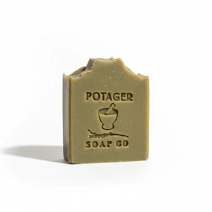 Potager Soap Co. lavender and patchouli botanical bar soap with a rustic, earthy green finish and embossed logo.