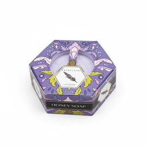 Potager Soap Co. Baudelaire lavender honey soap bar in a decorative purple hexagonal gift box on a white background.
