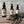 Three Potager Soap Co. amber glass bottles of organic French Lavender room and linen spray with dried lavender stems.