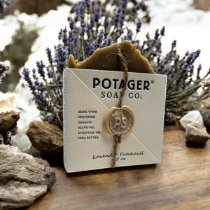 Potager Soap Co. Lavender Patchouli organic bar soap in eco-friendly packaging with twine and wax seal on wood table.