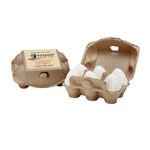Potager Soap Co. Lemongrass Calendula bath bomb eggs in a rustic recycled paper carton for a spa-like bath experience.