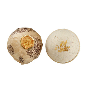 Potager Soap Co. lemongrass bath bomb sphere with calendula petals and artisanal paper wrap with gold wax seal.