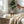Potager Soap Co. organic lemongrass room and linen spray in amber glass bottles being misted over white linens.
