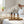 Potager Soap Co. organic lemongrass room and linen spray in amber glass bottles on a wooden tray in a bright bedroom