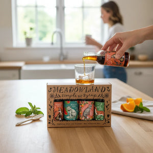 Potager Soap Co. Meadowland Fox Collection simple syrup gift set with four artisanal bottles on a wooden kitchen table