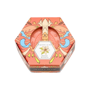 Potager Soap Co. orange blossom honey soap in a decorative hexagonal box with folk art floral illustrations.